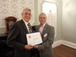 Andrew receives his Paul Harris Fellowship Certificate from District Governor Bob Maskell